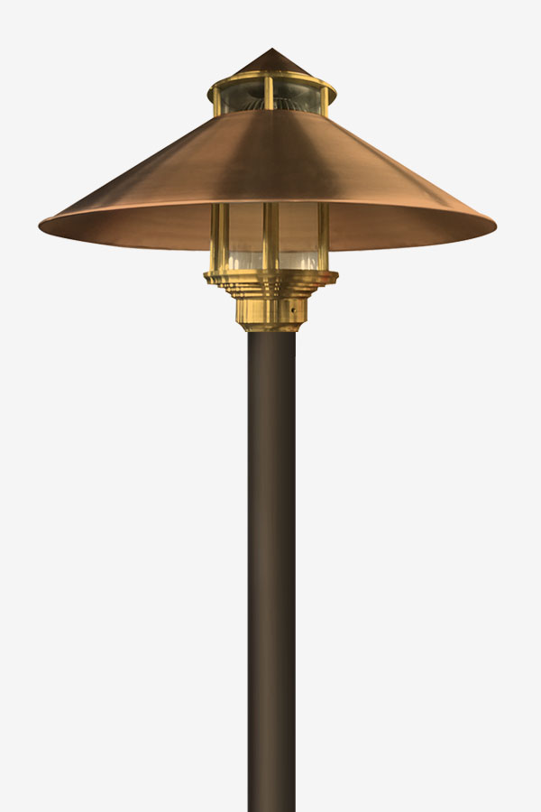 A lamp is shown with a gold shade.