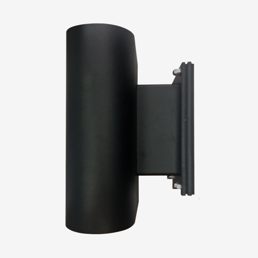 A black wall light with a white background